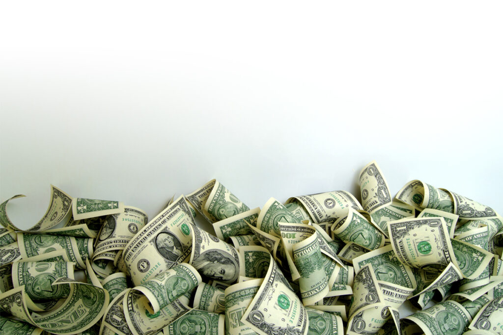 Pile of money on white background