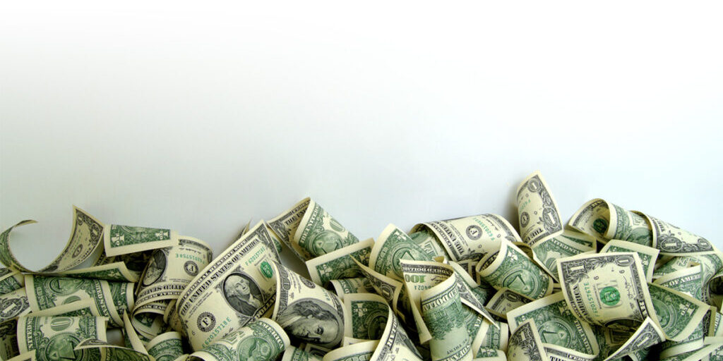Pile of money on white background