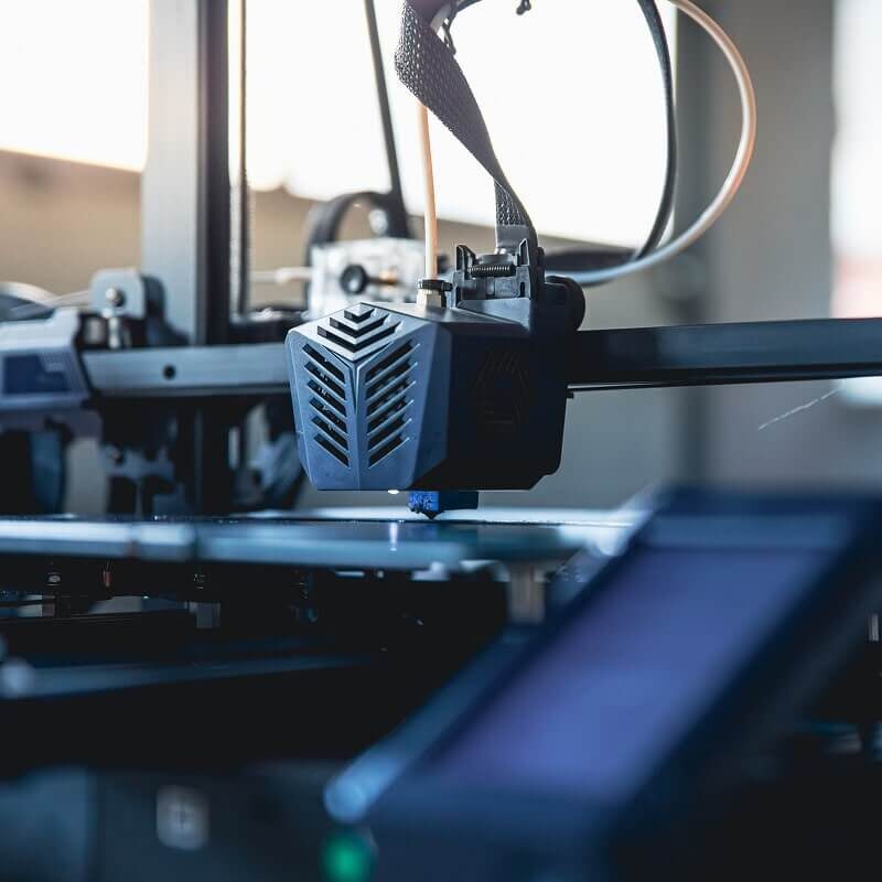 Industrial fabrication equipment with metal components and mechanical parts in manufacturing setting.